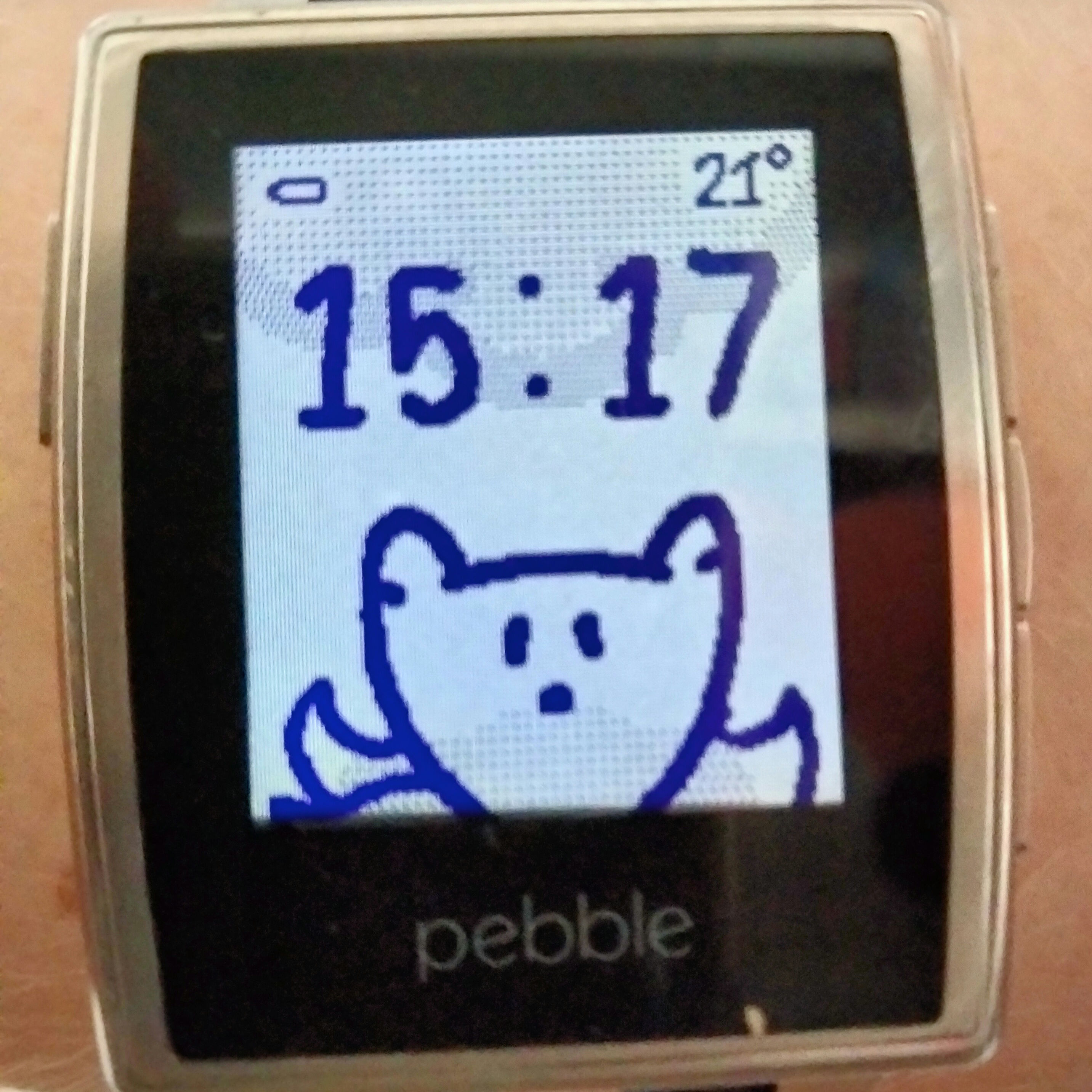 a watchface with a fox showing low battery, 21deg, 15:17, and cloudy